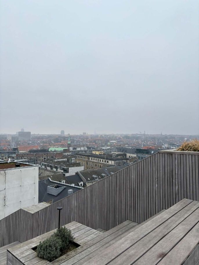 A foggy Aarhus skyline from a rooftop