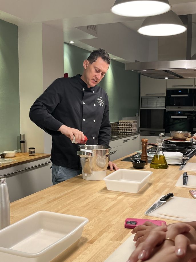 The chef preparing a plate. 
