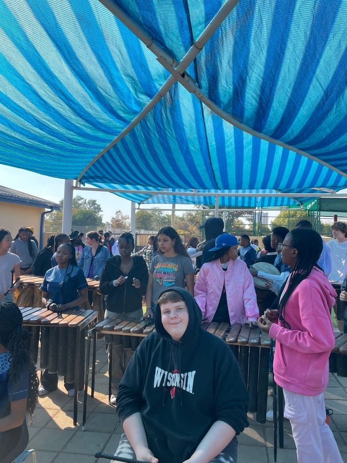 Global Navigators and Legae Academy students playing marimbas together