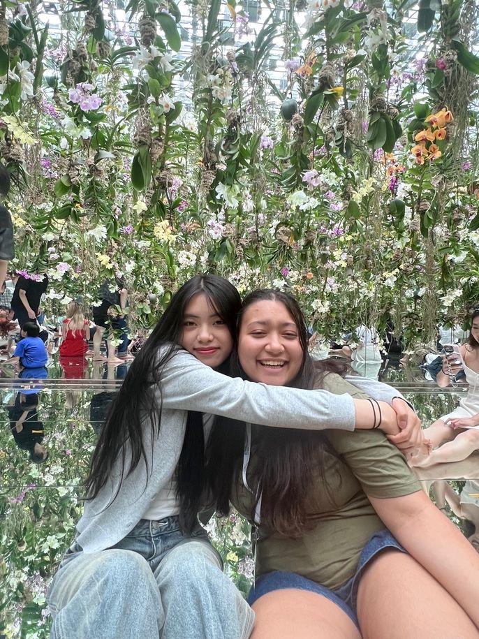 sitting under the flowers