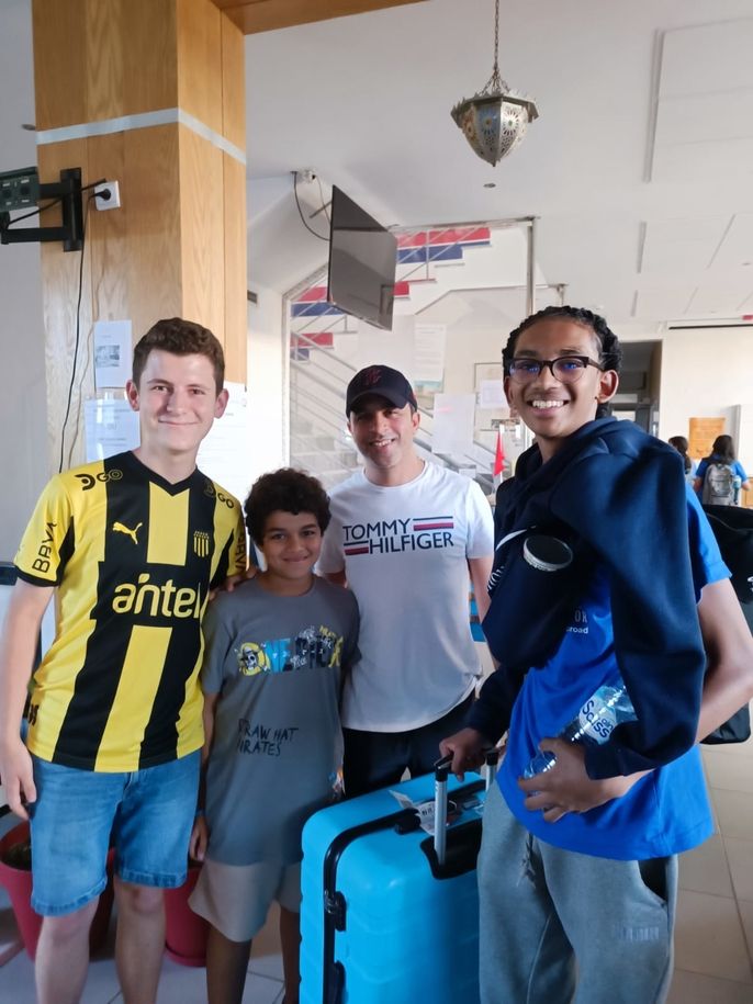 Micah with his host family