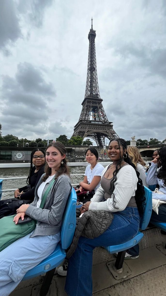 Upper deck of bateau mouche with Eiffel tower in the bacground.