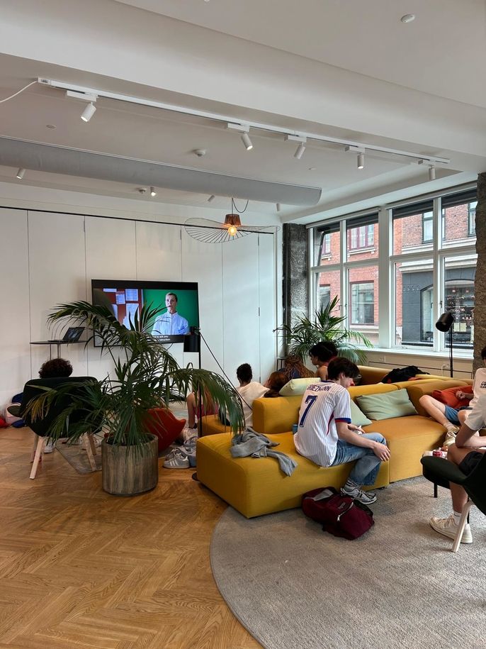 Students relaxing in the lounge for movie night.