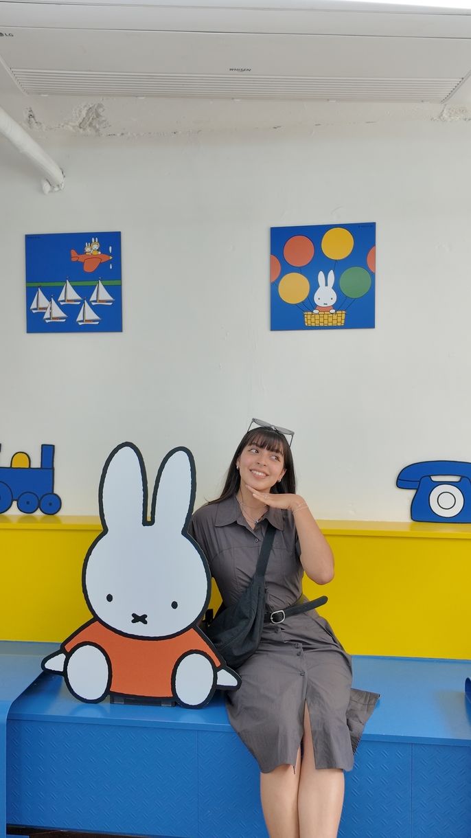 Author posing with Miffy in Cafe