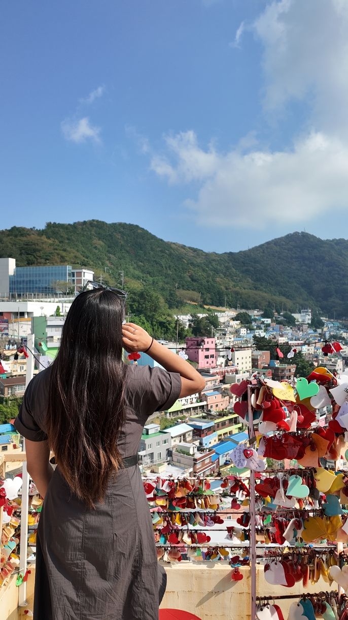 Author posing in front of Gamcheon Culture Village