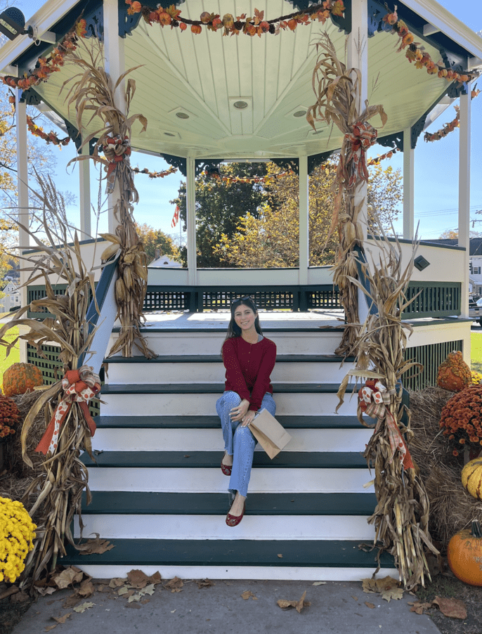 Emma sitting on gazebo