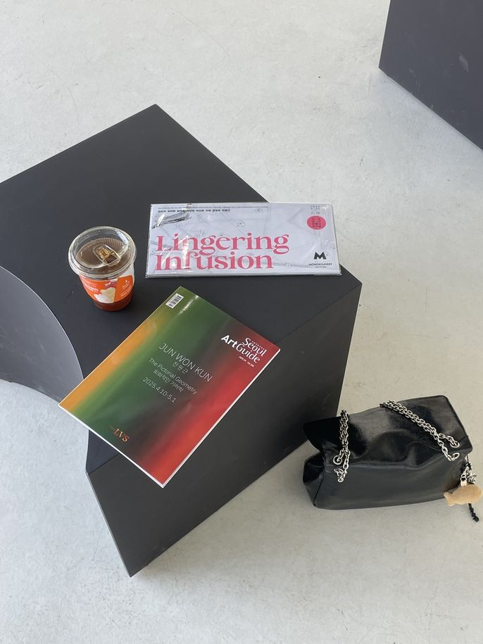 Lingering Infusion Artist cards with coffee on a bench