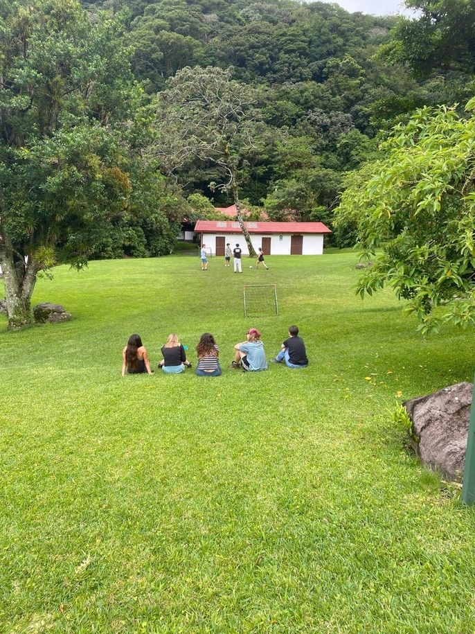 Group of students watch each other play soccer