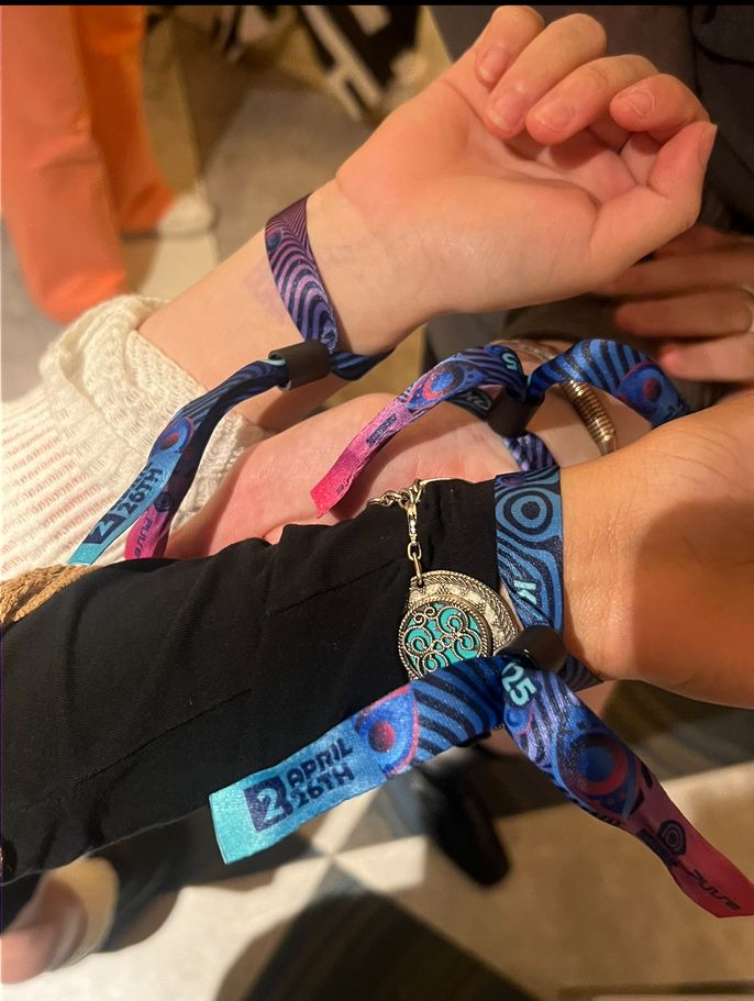 Friends wearing EDC Korea Day 2 wristbands