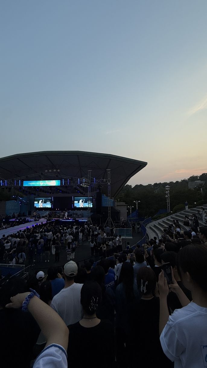 In Yonsei's amphitheater Silica Gel performs to a full audience while the sun sets in the background