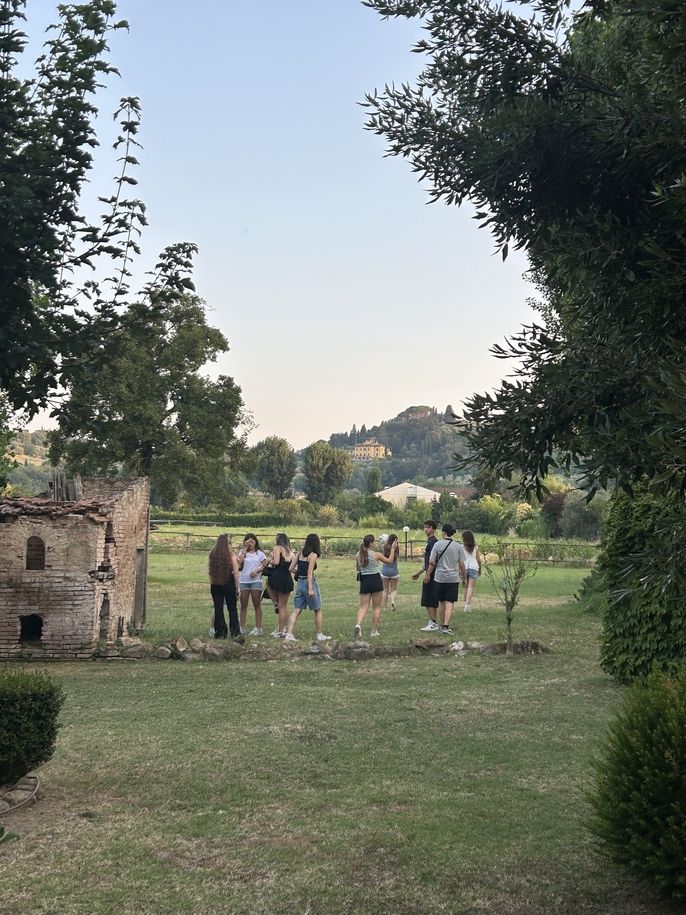 Students spending time in the yard at their farmhouse residence in Florence Italy