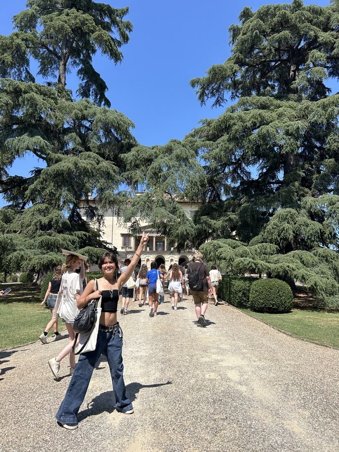Student posing in front of Villa Medicea di Poggio a Caiano in Florence, Italy