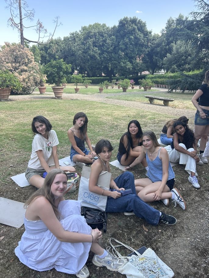 Students sitting in the garden at Villa Medicea di Poggio a Caiano in Florence, Italy