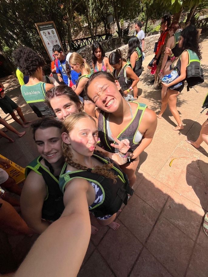 Students with their life vests on, getting ready to go into a cenote