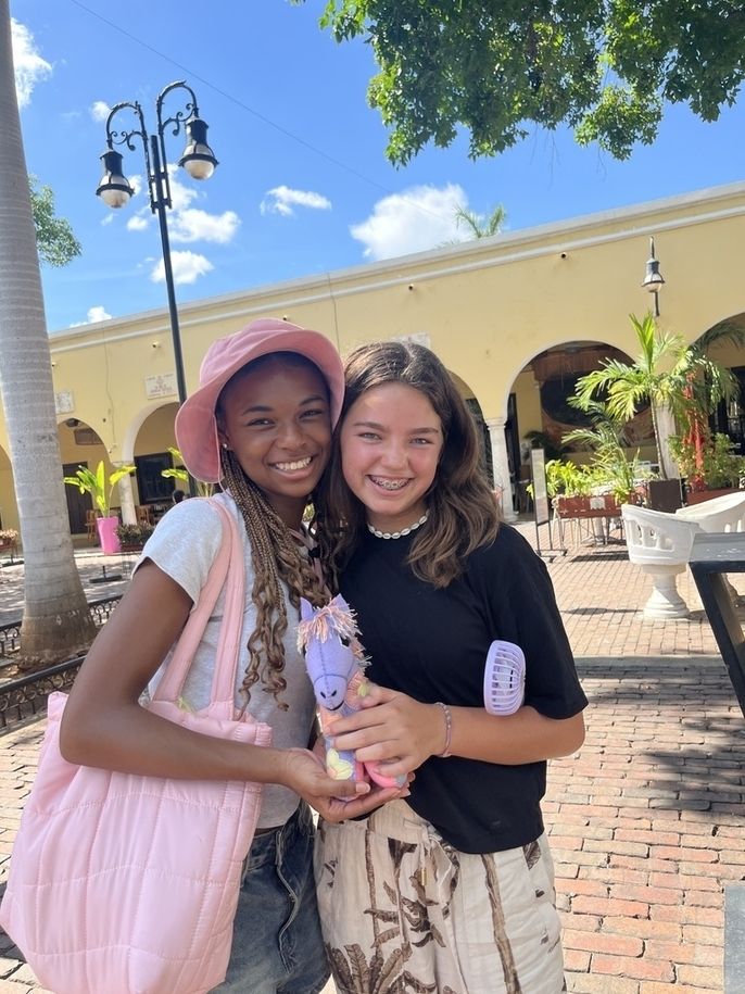 Two HSSA students shop for handicrafts