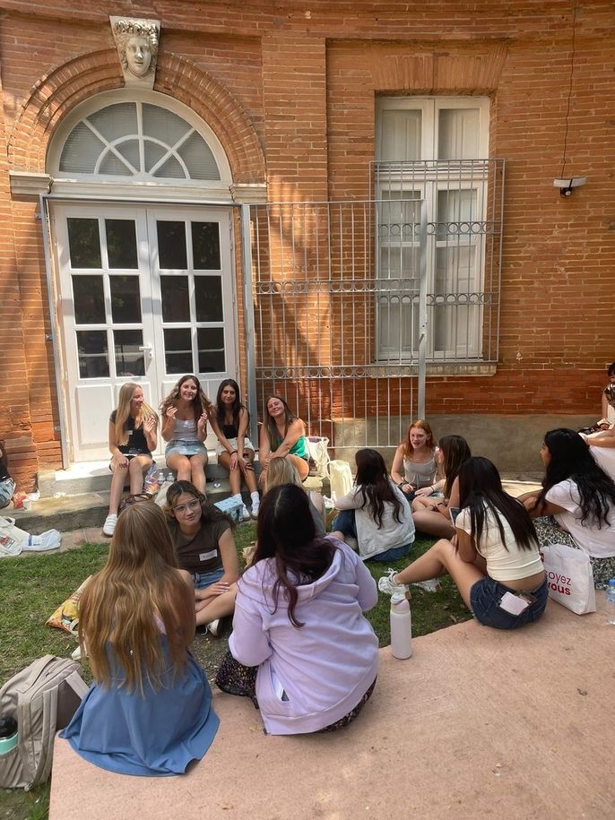 A group of students sitting and chatting