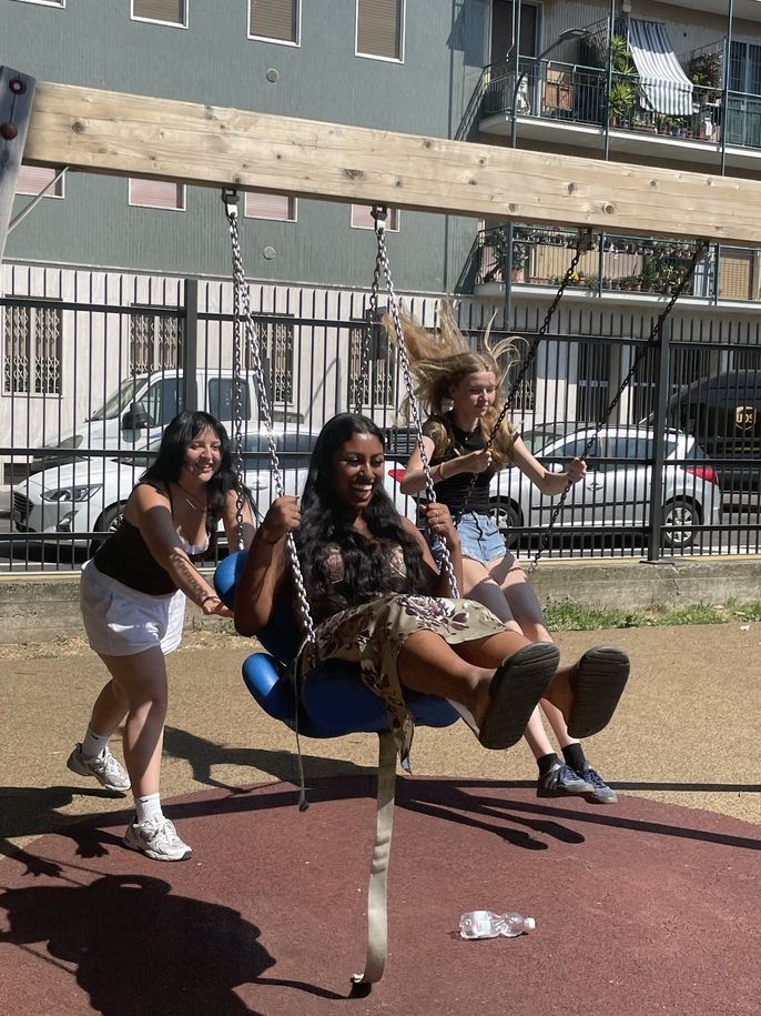 Students swing on swingset