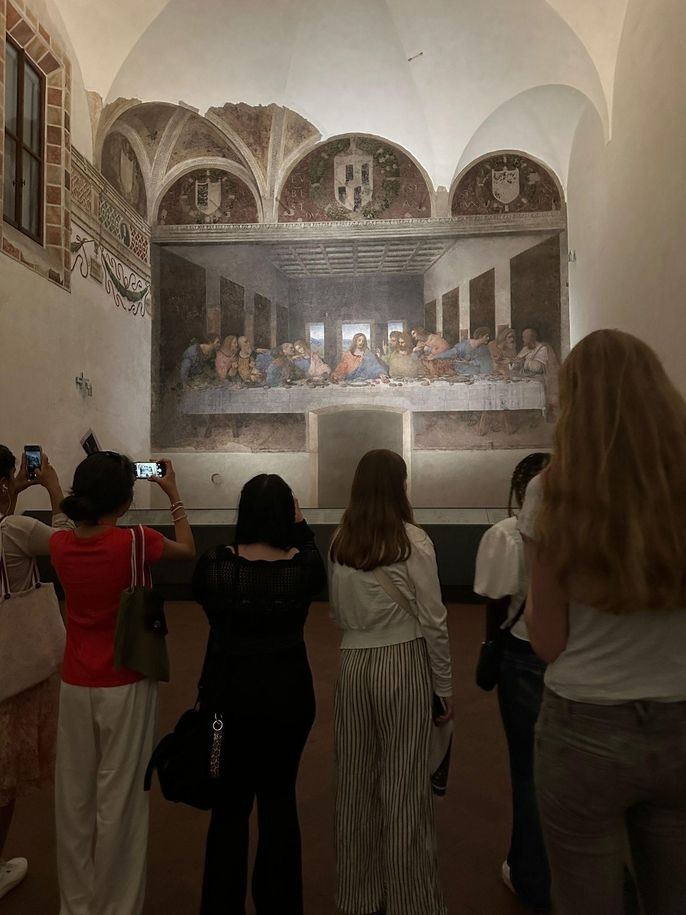 Students view last supper