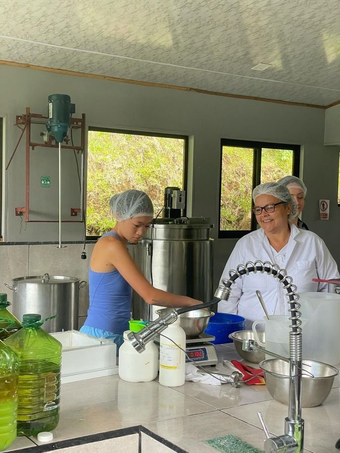 Ava, a high school student, mixing soap ingredients