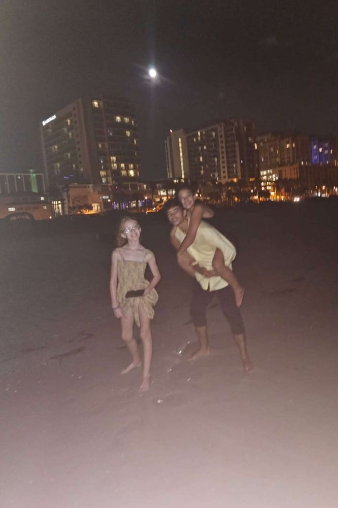 Dominick and his sister and cousin at the beach