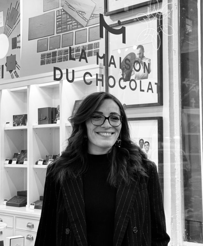 Eloise stands in front of La Maison du Chocolat, which is where she completed her CIEE BridgeUSA intern program.