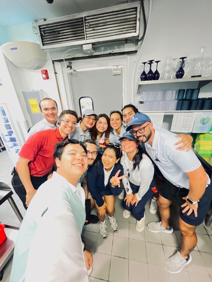 Katherine poses with her Ritz-Carlton coworkers.