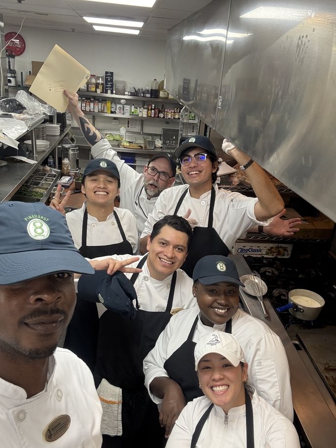 Danial poses with his internship friends for a photo.
