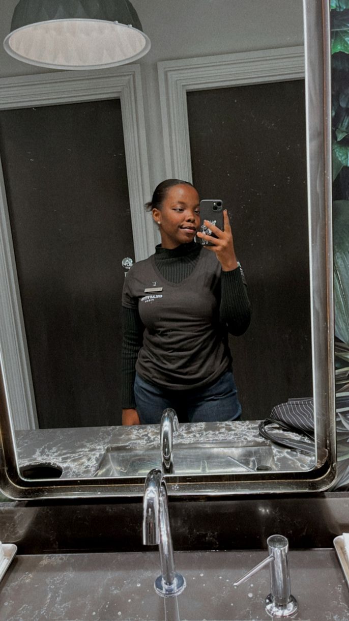 Naomi takes a selfie at work.