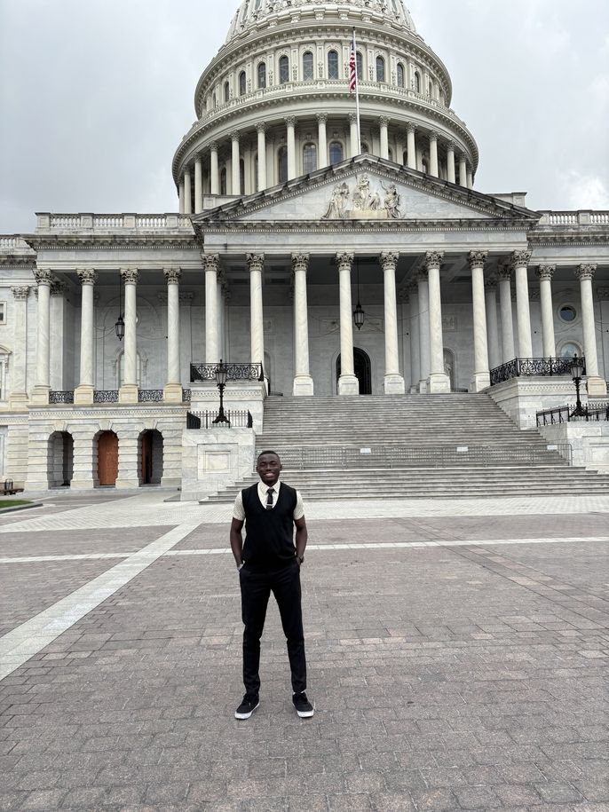 Elijah stands outside the U.S. Capitol Building.