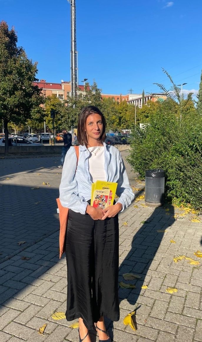 Diana Biagini (Program Coordinator) promoting the Festival dei Popoli by distributing leaflets in Florence's outlying neighborhoods.