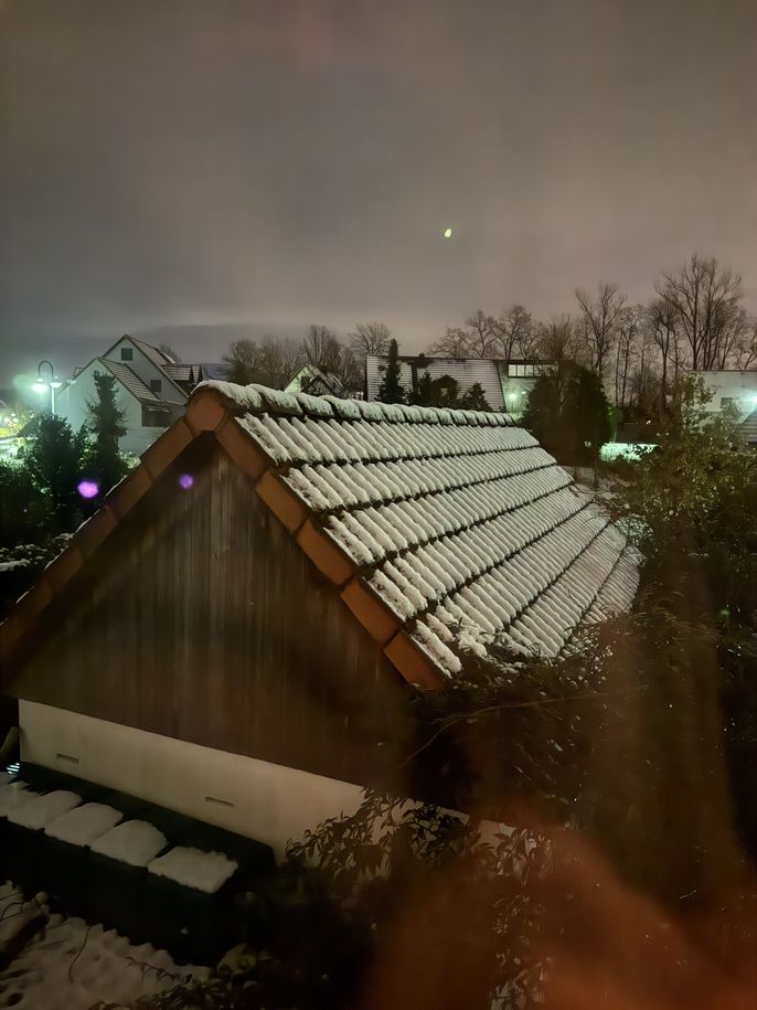 Snow lands on German rooftops