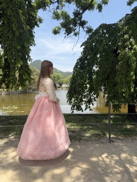 Girl wearing hanbok with forest background