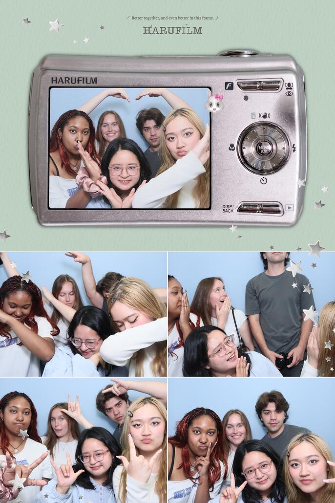 friends doing different poses at a photobooth