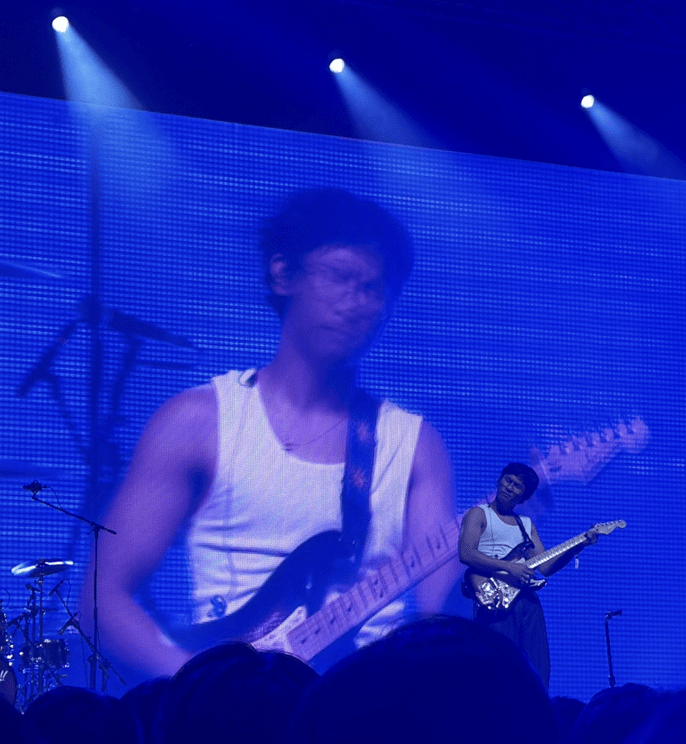 Grent Perez playing guitar and singing