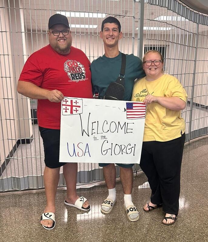 Jarred and Shannon Johnston welcome their exchange student Giorgi (center) from the country Georgia.