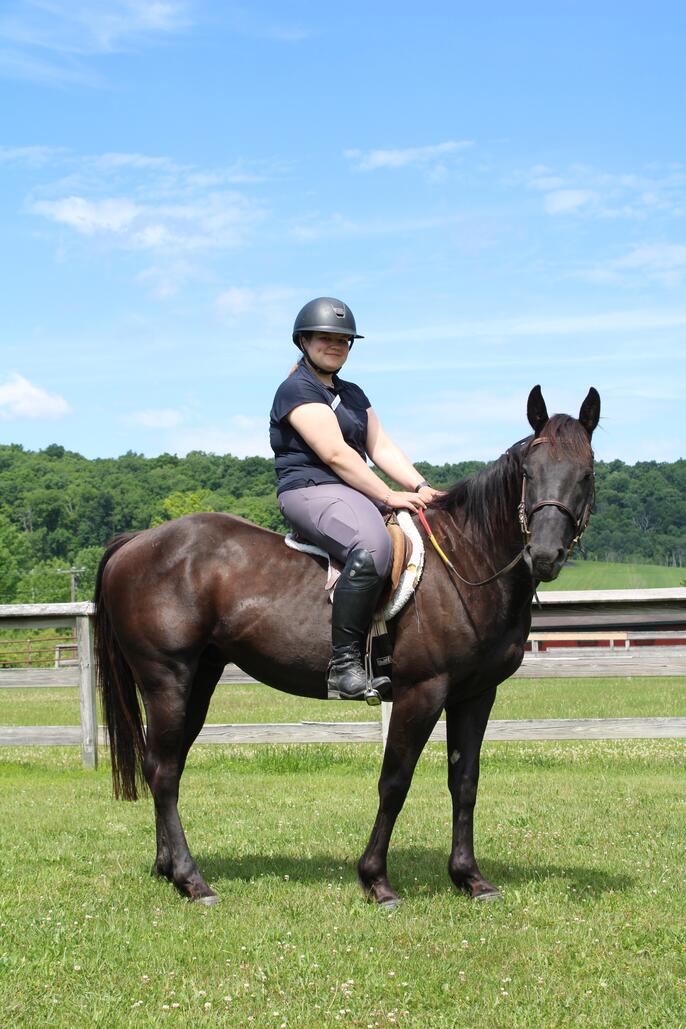 Venla S. poses on her horse