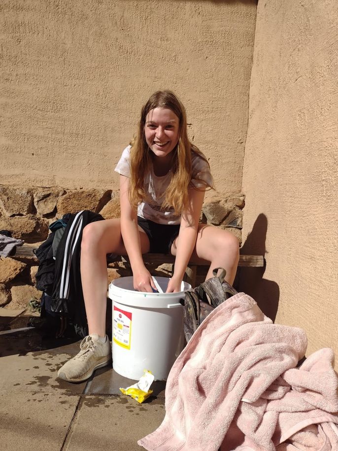 High school girl doing laundry manually in Botswana