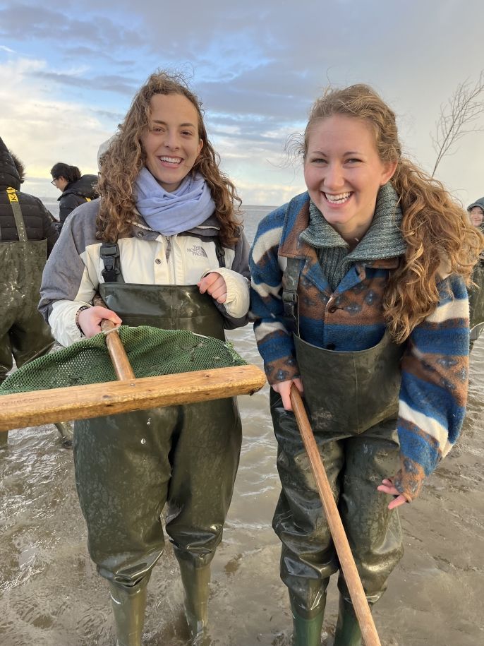 Copenhagen girls in waders in mudflats