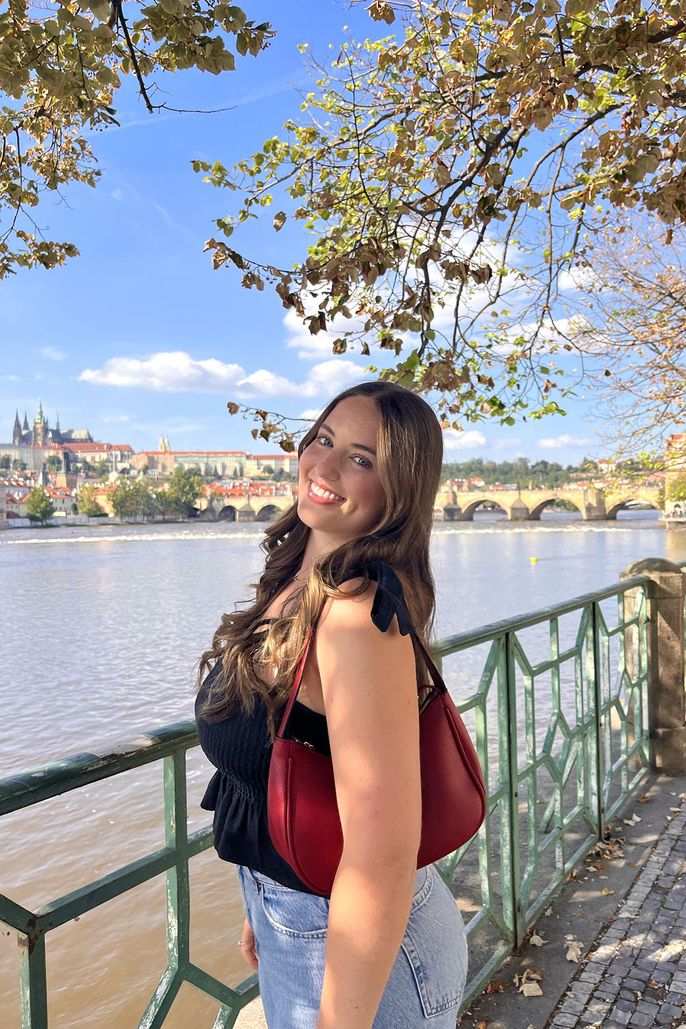 student by the river in Prague