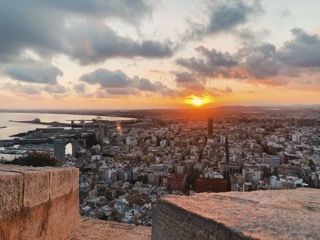 A breathtaking view of the city from the top of the Santa Bárbara castle, taken minutes before sunset.