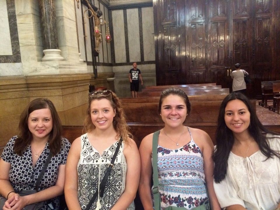 My roommates and I at mass (with our host family).