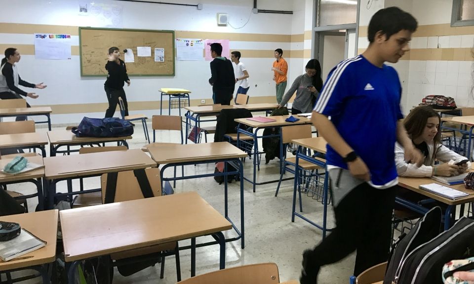 Students interacting with each other in a Spanish classroom