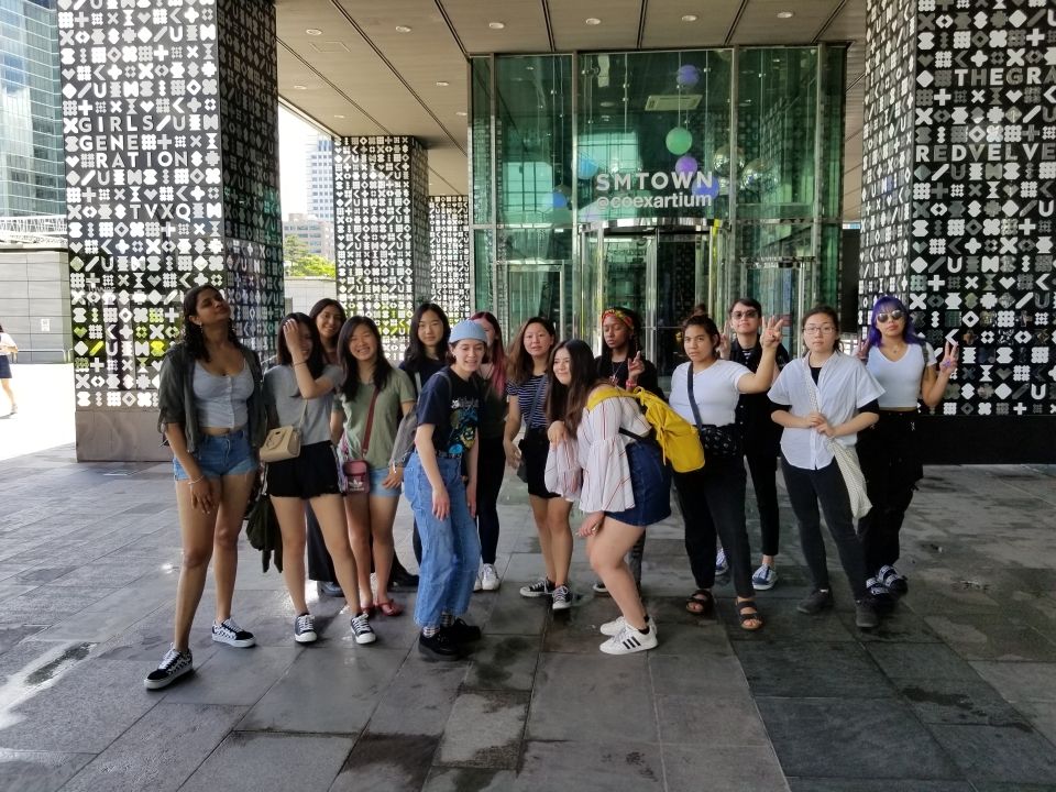 Group photo of students in front of the SM Town Museum at COEX Mall.