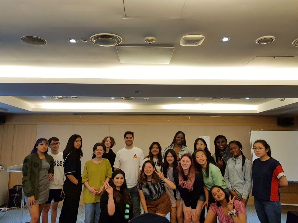 Students in a group photo with famous K-pop producer, Paul Thompson.