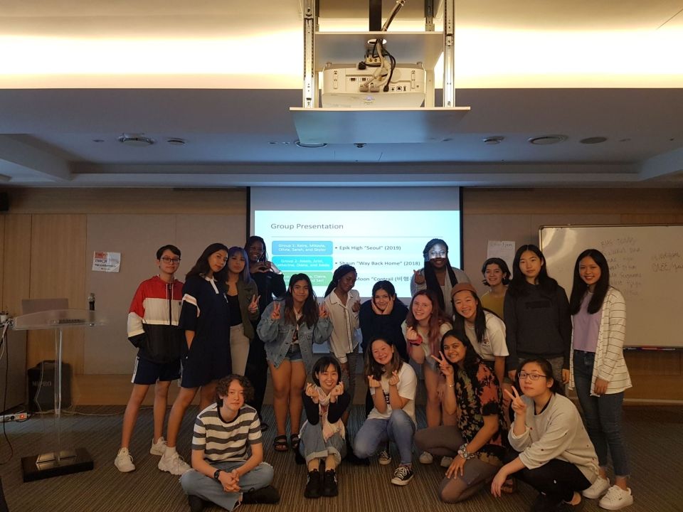 Students in a group photo with their K-pop instructor, Dr. Kim.