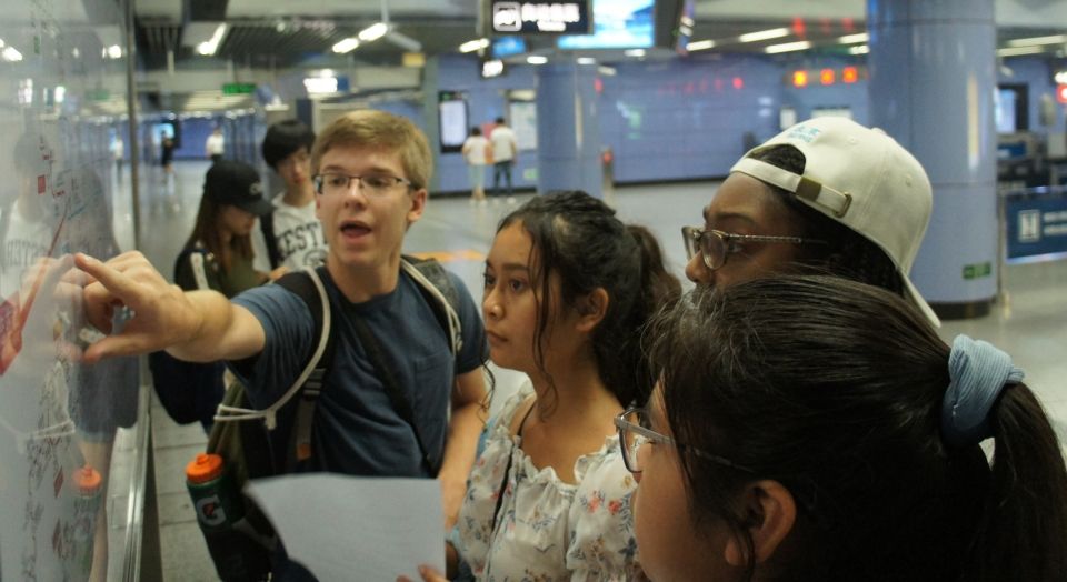 The students study a map of Beijing's Metro system