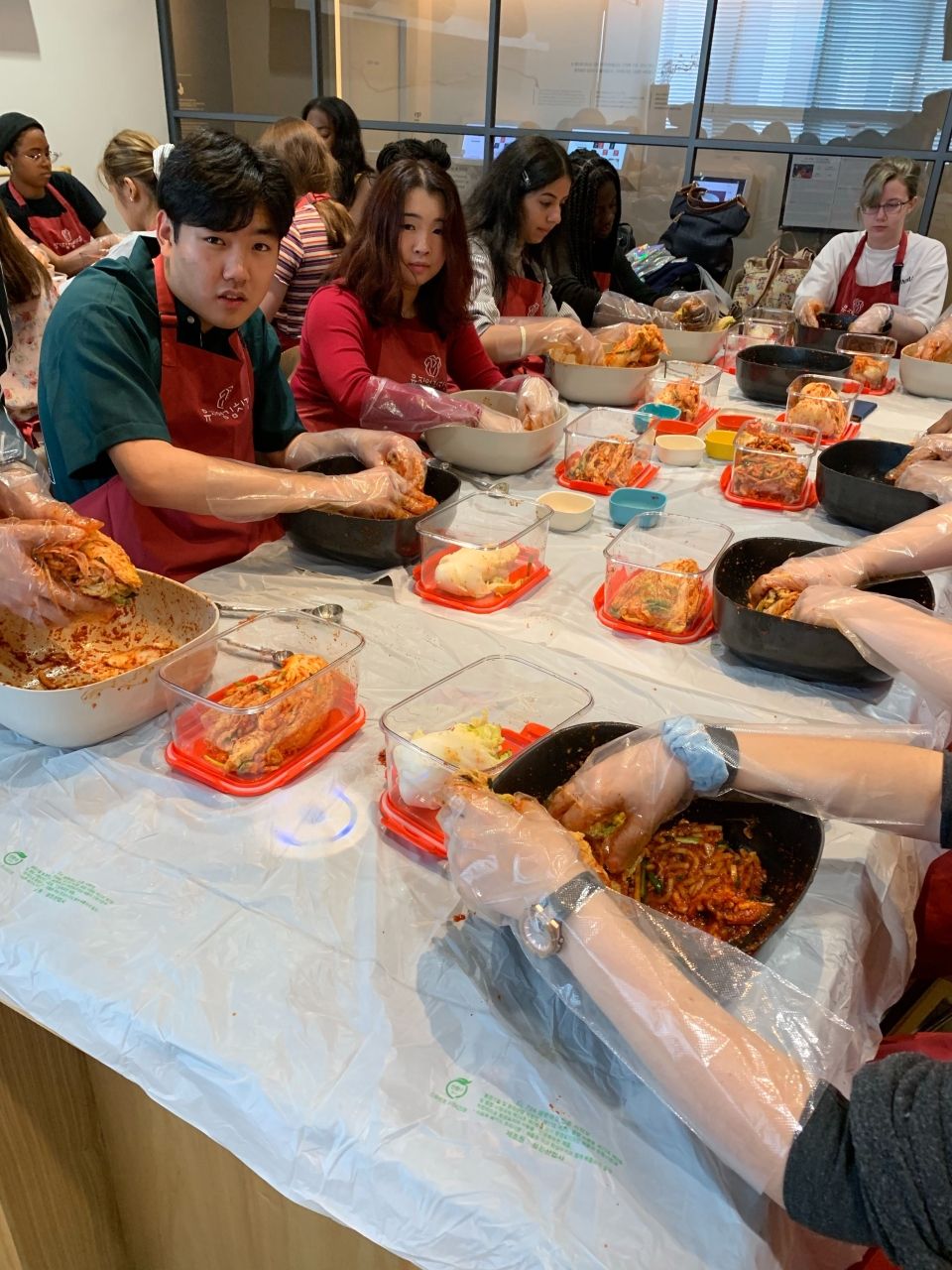 Students making Kimchi inside the Kimchi Museum.