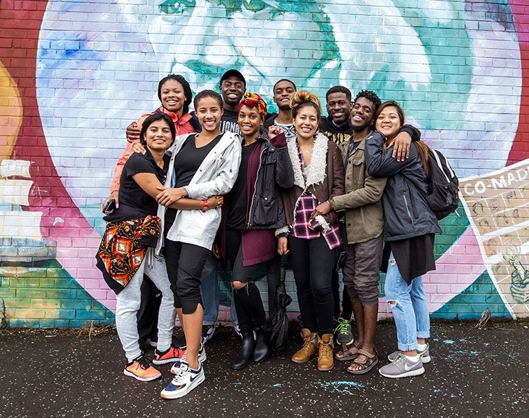Frederick Douglass Fellows stand in front of his mural in Ireland
