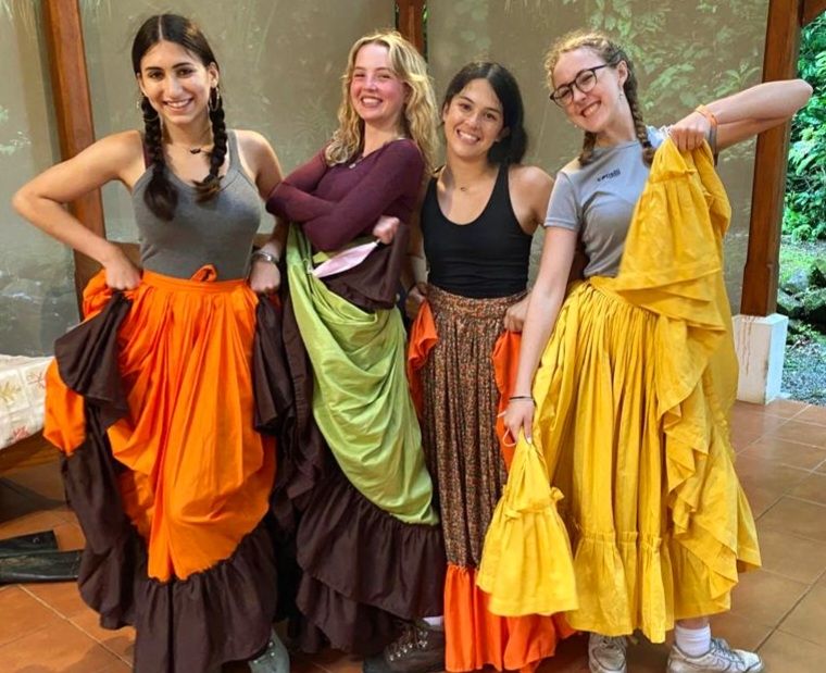 Students dressed in Costa Rican dancing garb [from left to right: Madison (16), McKenzie (17), Lilly (16), Adah (17)]