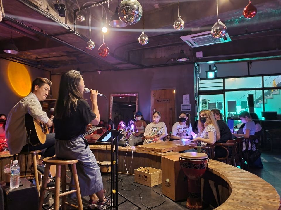 Indie band performing at an underground club in Hongdae